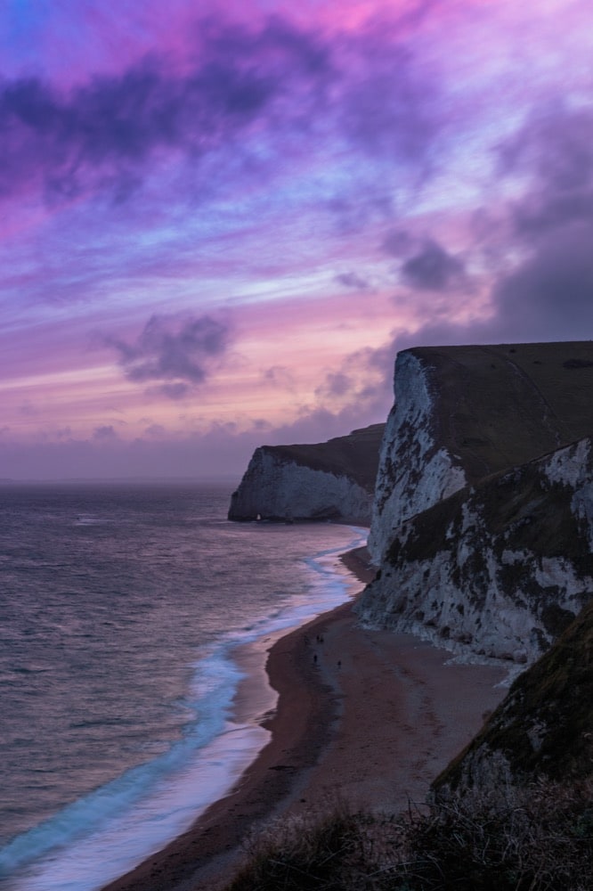 Purple sunset over UK coastal white cliffs