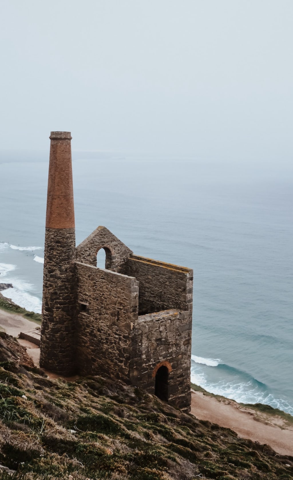 old mill with no roof on the coast